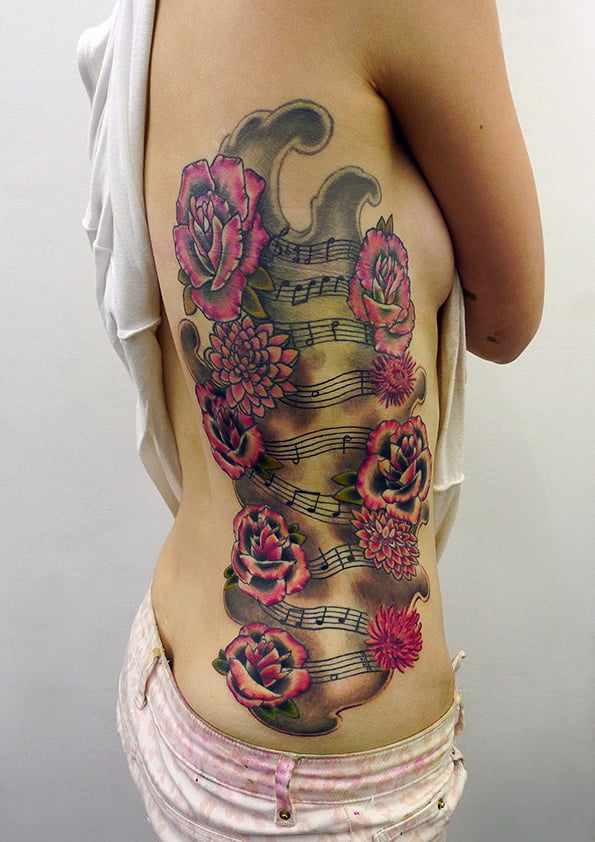 Roses and music notes tattoo