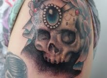 Skull and wreath tattoo