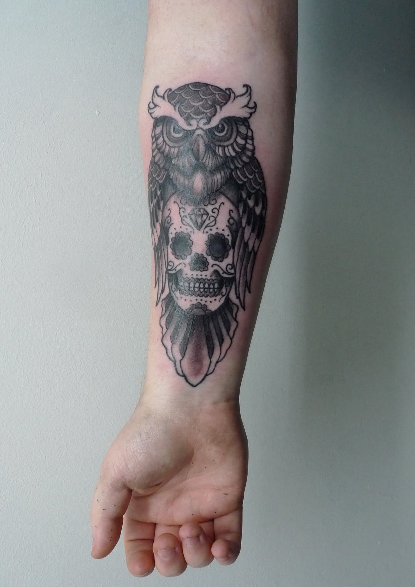 Owl and skull tattoo